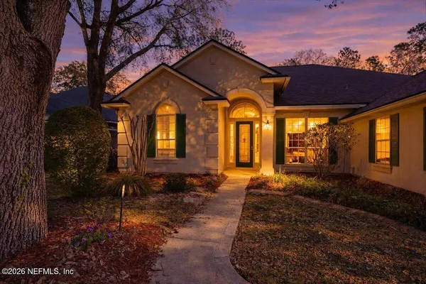 a view of entryway with a front door and wooden floor