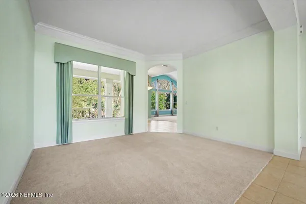 a view of a livingroom with furniture and a window