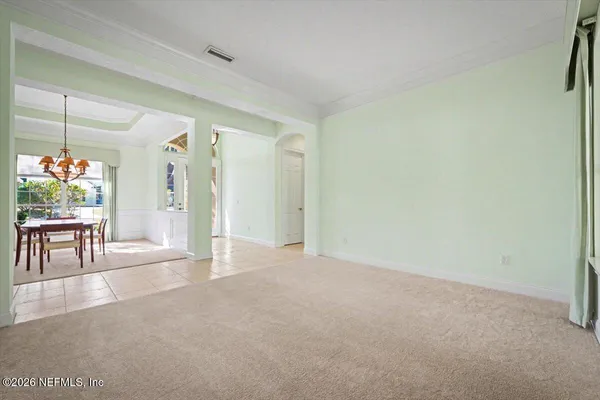 an empty room with furniture and a fireplace