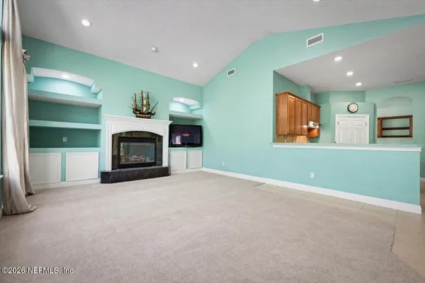 a view of an empty room with a window