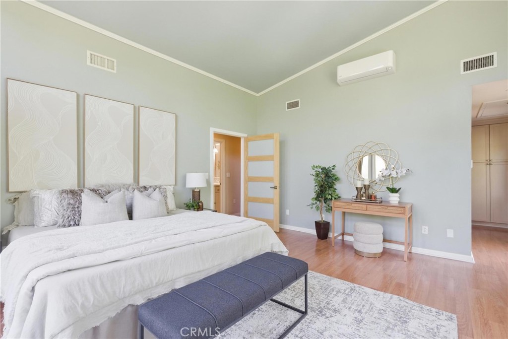 41 Hidden Valley Road Monrovia, CA 91016 - Photo 20 of 51 a bedroom with a bed and wooden floor