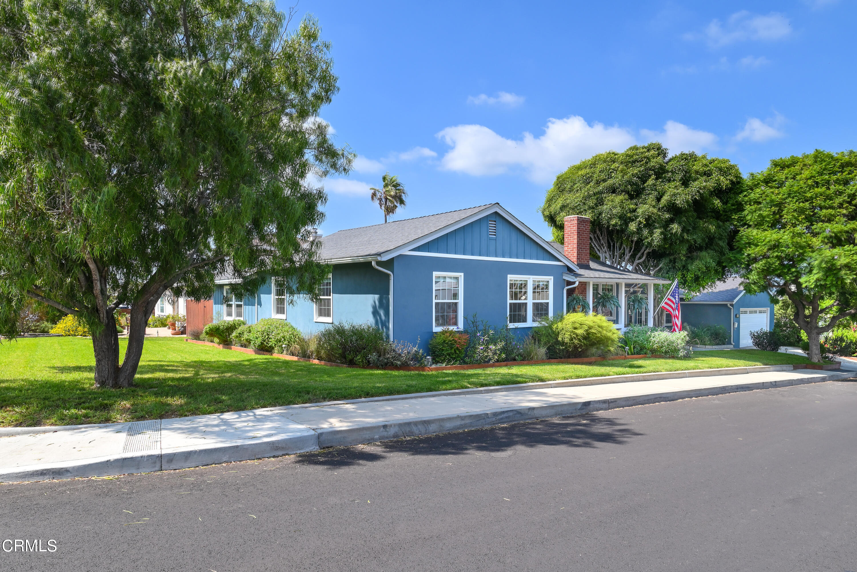 155 Cedar Drive Camarillo, CA 93010 - Photo 2 of 28 a front view of a house with a yard and trees
