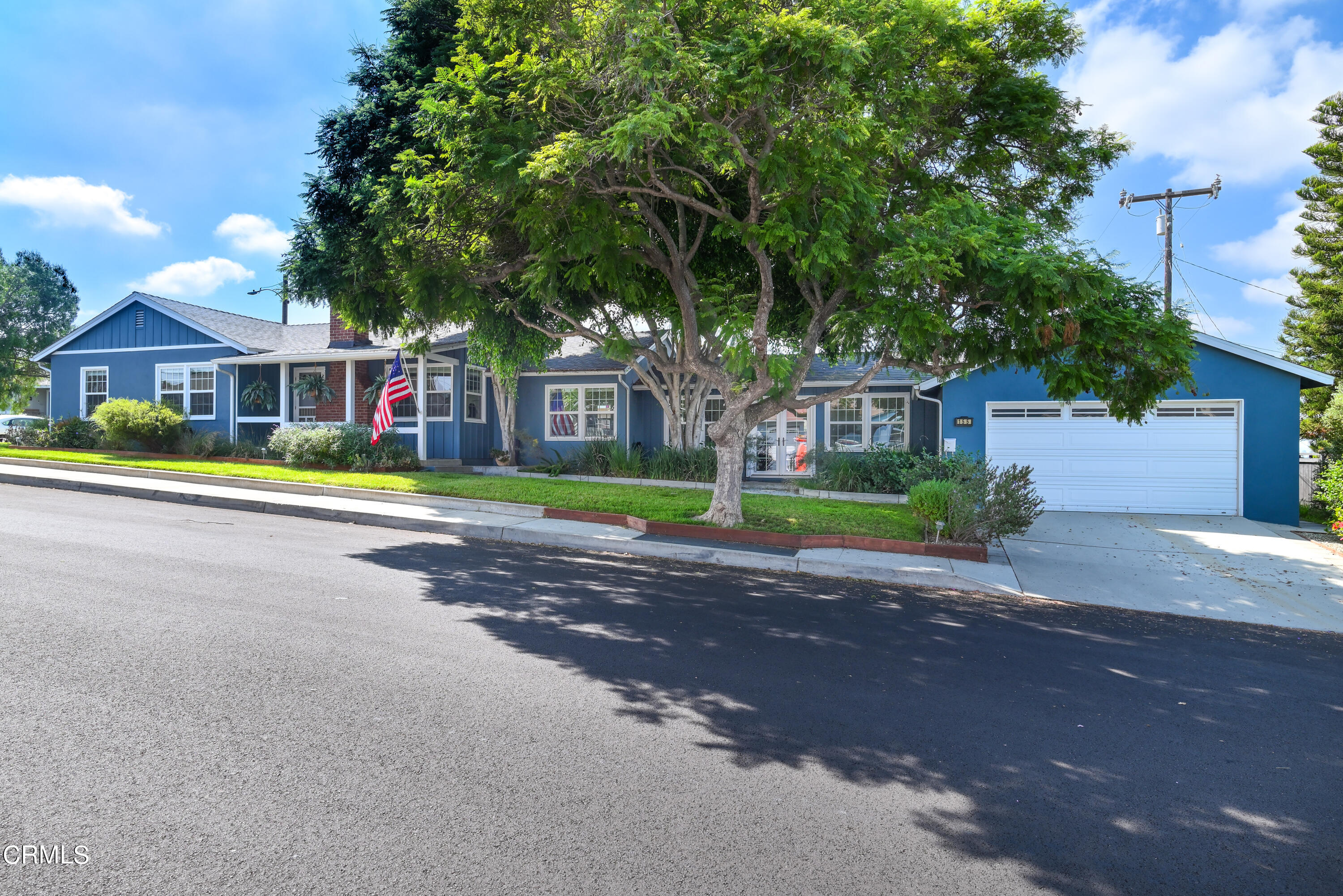 155 Cedar Drive Camarillo, CA 93010 - Photo 3 of 28 a front view of a house with a yard and road