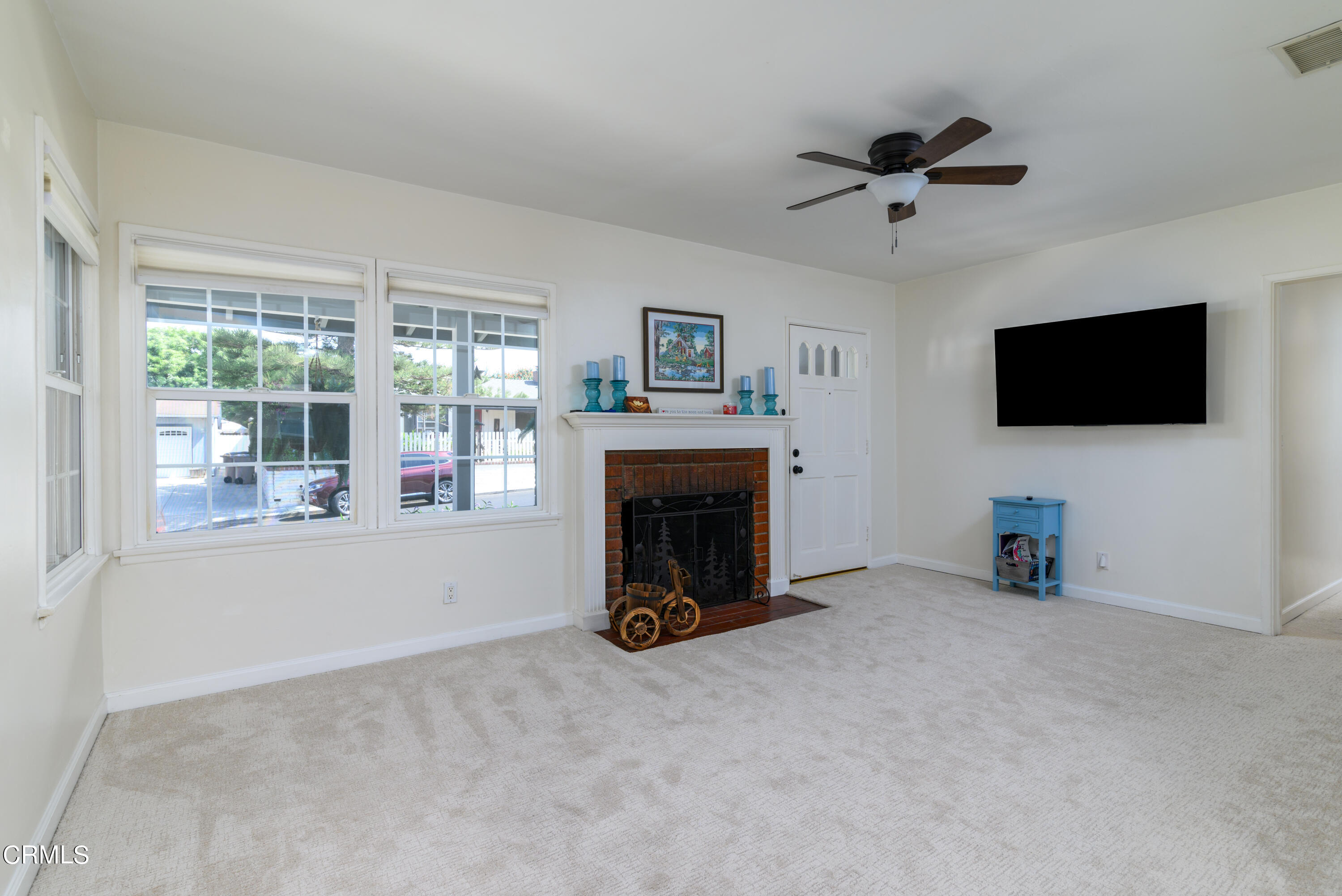 155 Cedar Drive Camarillo, CA 93010 - Photo 5 of 28 a view of livingroom with furniture fireplace and window