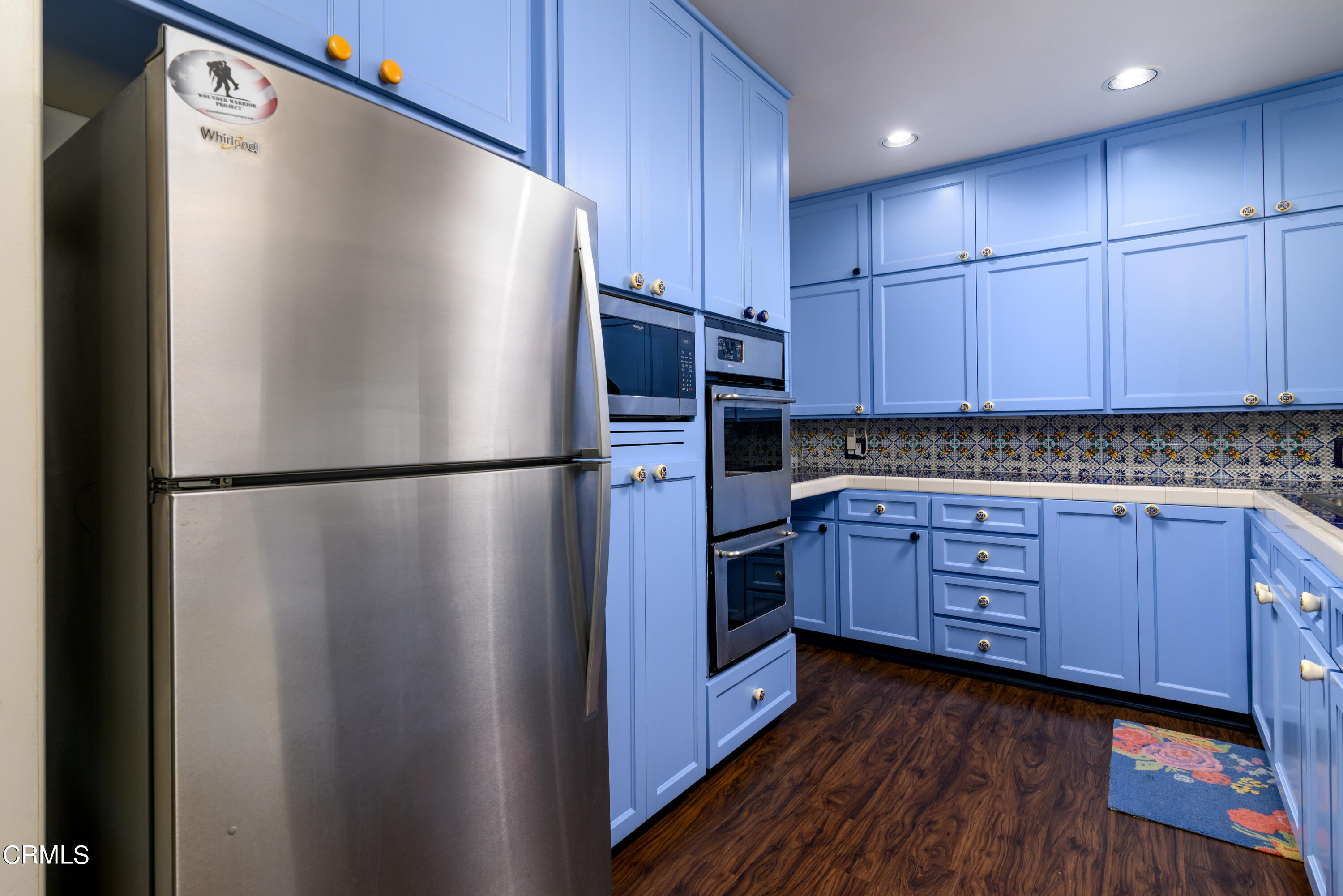 155 Cedar Drive Camarillo, CA 93010 - Photo 7 of 28 a kitchen with stainless steel appliances granite countertop a refrigerator and a stove top oven