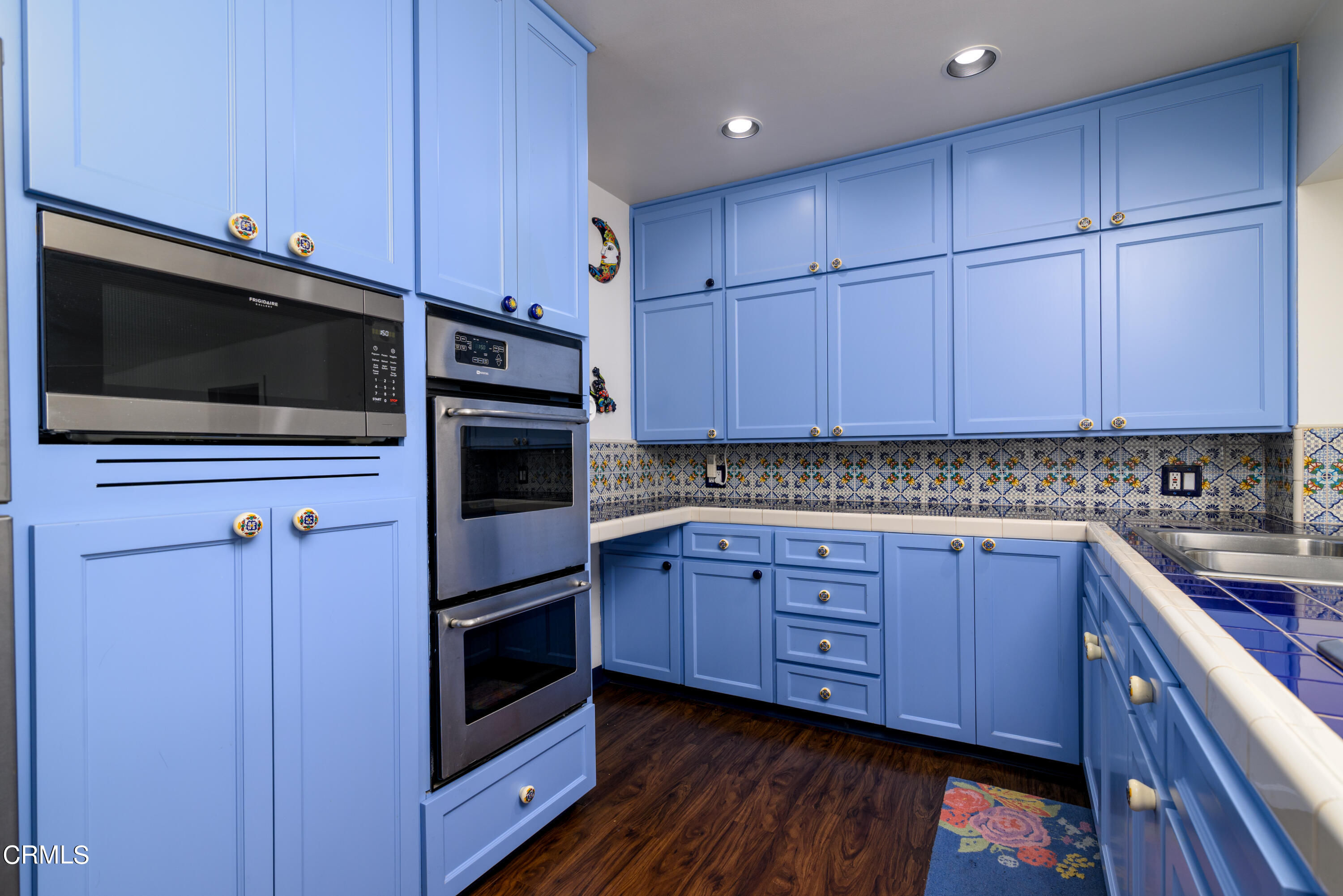 155 Cedar Drive Camarillo, CA 93010 - Photo 8 of 28 a kitchen with stainless steel appliances granite countertop wooden cabinets and a stove top oven