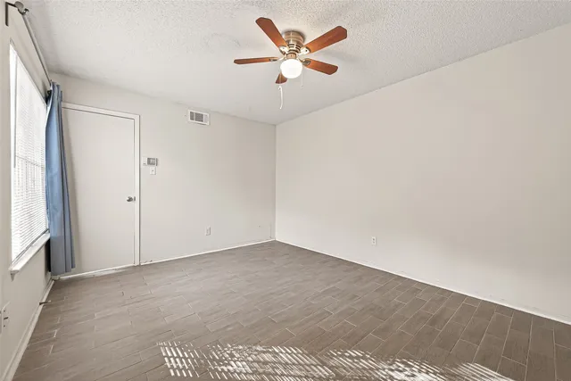a view of staircase with white walls and chandelier