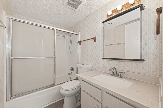 a view of hallway with wooden floor