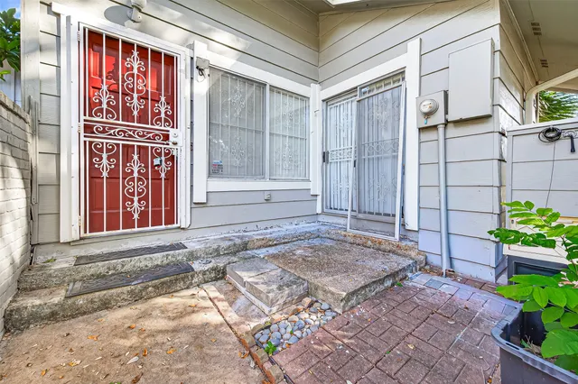 a view of livingroom with hardwood floor and a kitchen