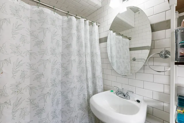 a bathroom with a sink and mirror