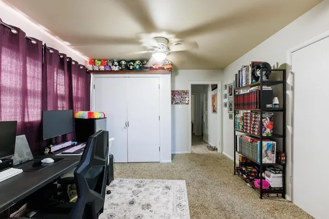 a workspace with furniture and bookshelf