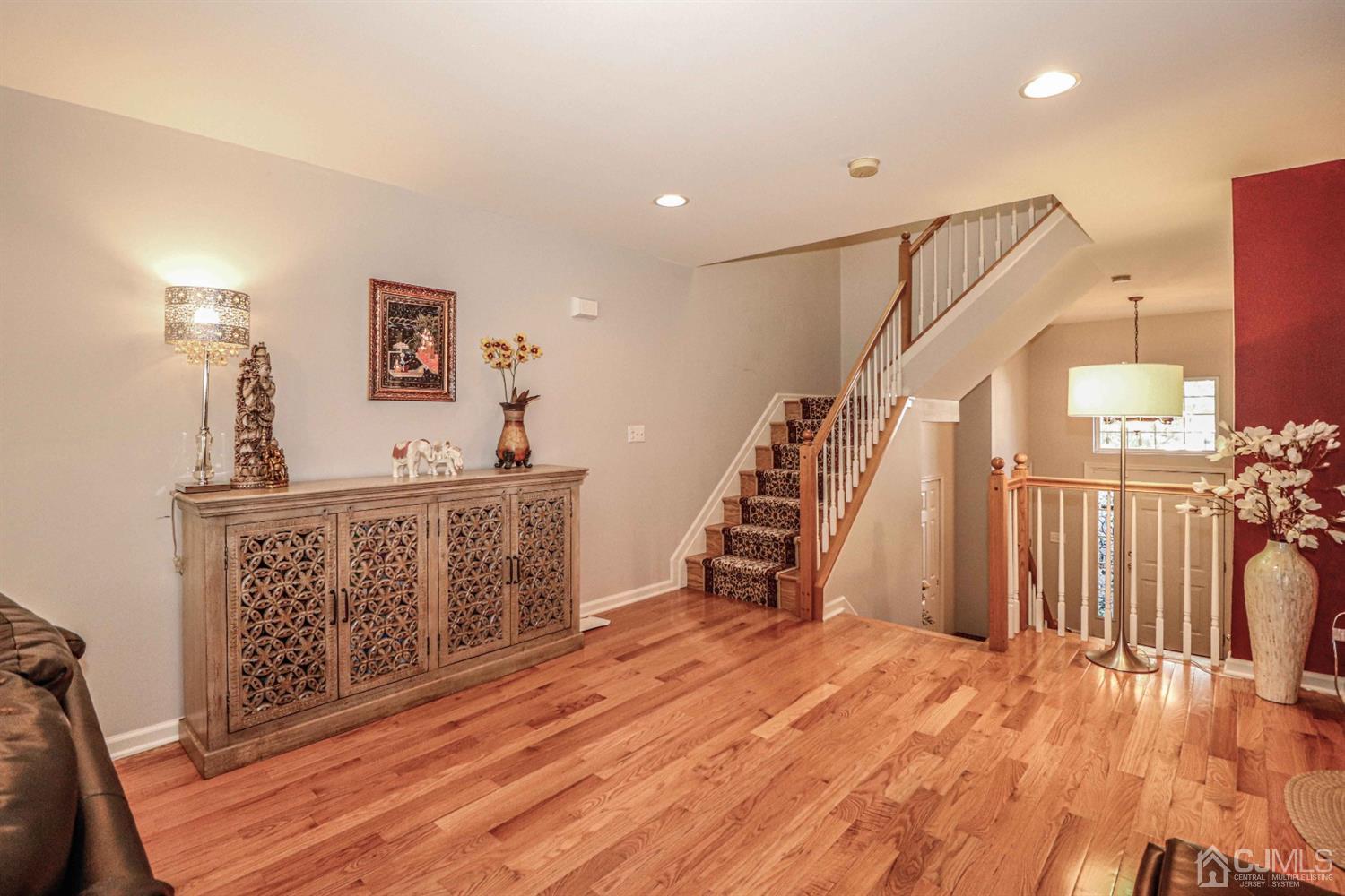 31 Harbor Bay Circle Old Bridge, NJ 08879 - Photo 11 of 36 a view of a hallway with wooden floor and stairs