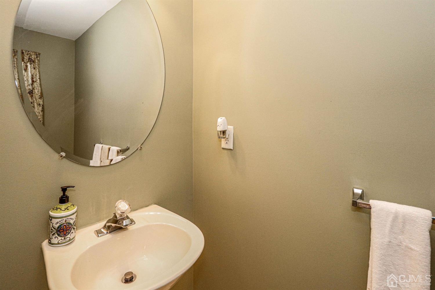 31 Harbor Bay Circle Old Bridge, NJ 08879 - Photo 16 of 36 a bathroom with a sink and a mirror