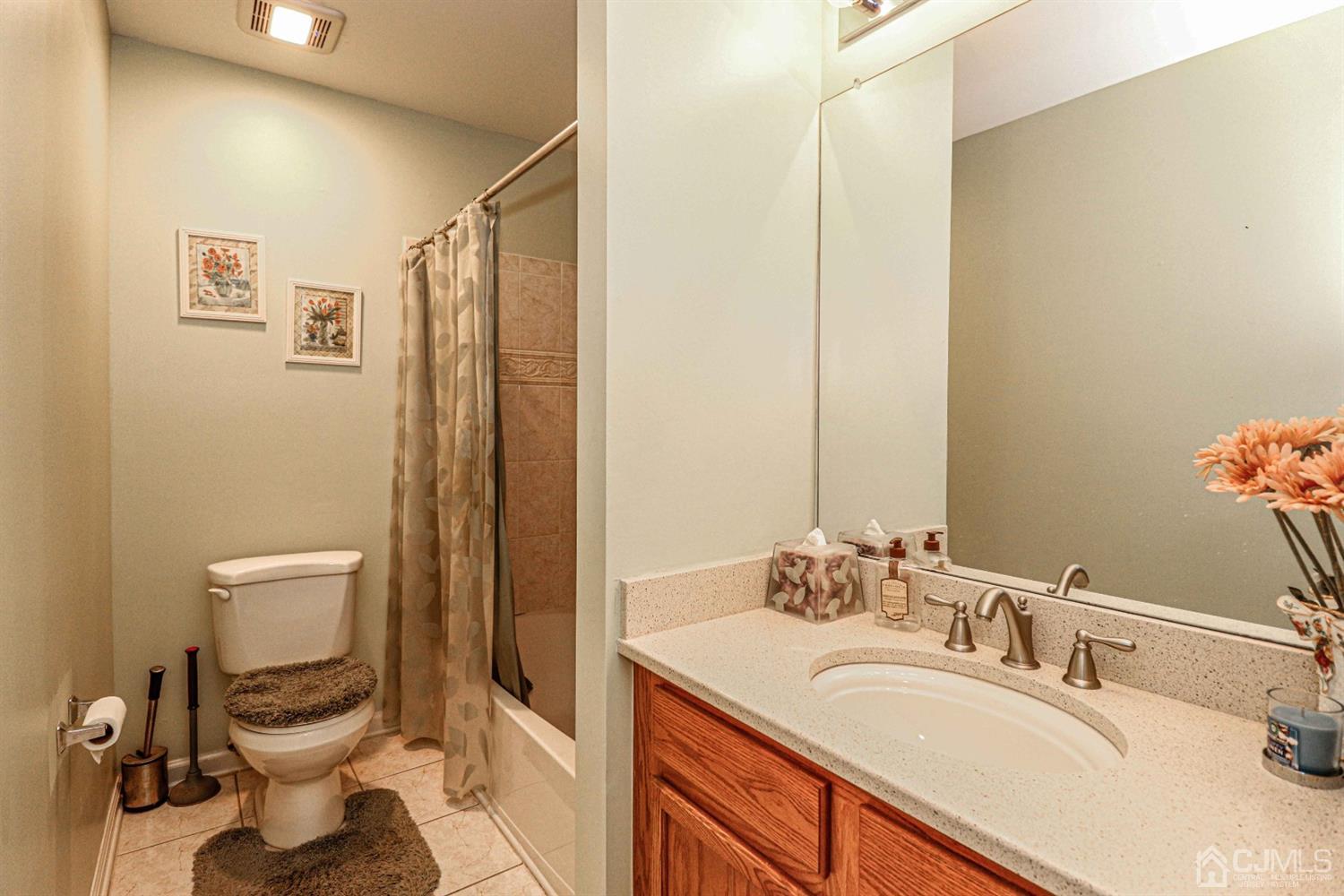31 Harbor Bay Circle Old Bridge, NJ 08879 - Photo 17 of 36 a bathroom with a granite countertop sink mirror and a toilet
