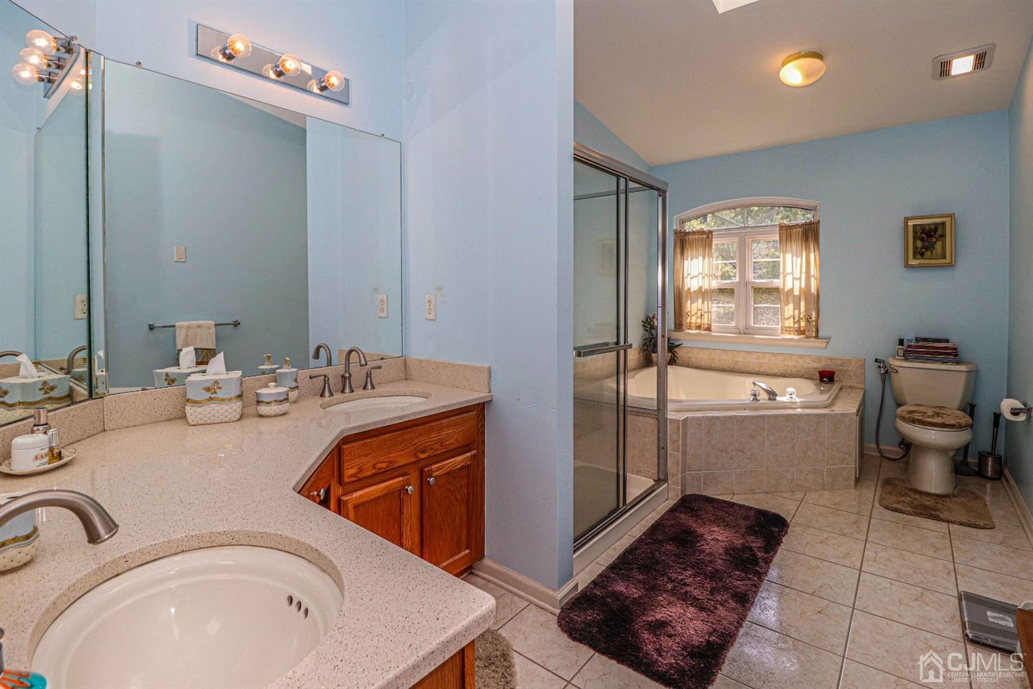 31 Harbor Bay Circle Old Bridge, NJ 08879 - Photo 18 of 36 a bathroom with a sink a toilet and mirror