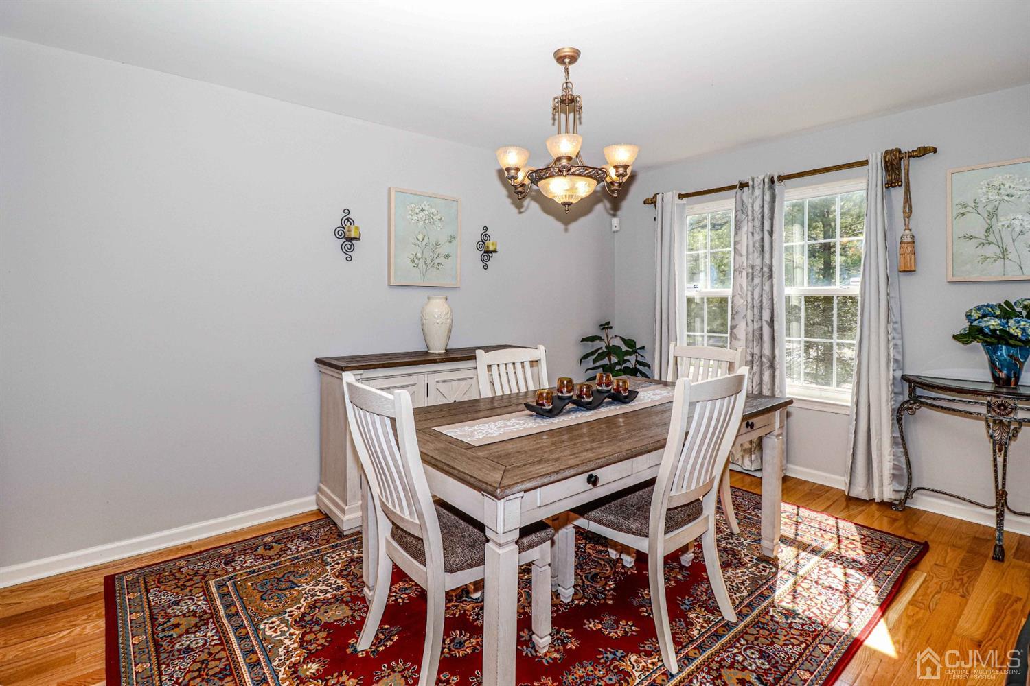 31 Harbor Bay Circle Old Bridge, NJ 08879 - Photo 7 of 36 a view of a dining room with furniture and chandelier