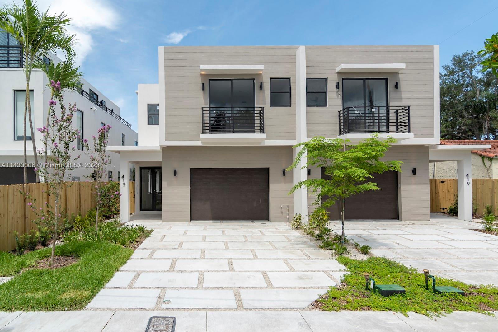 419 Northeast 16th Avenue Fort Lauderdale, FL 33301 - Photo 1 of 56 a front view of a house with a yard