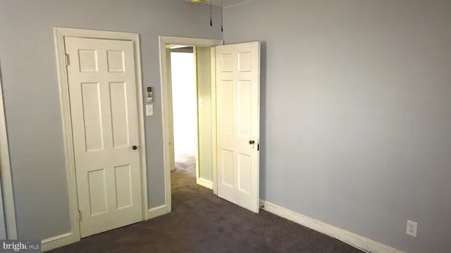 a view of a bathroom with a shower and a window