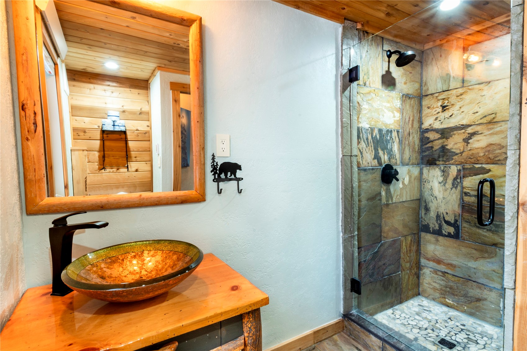 2739 Burgess Creek Road, Unit 10 Steamboat Springs, CO 80487 - Photo 14 of 46 a bathroom with a sink a mirror and a shower