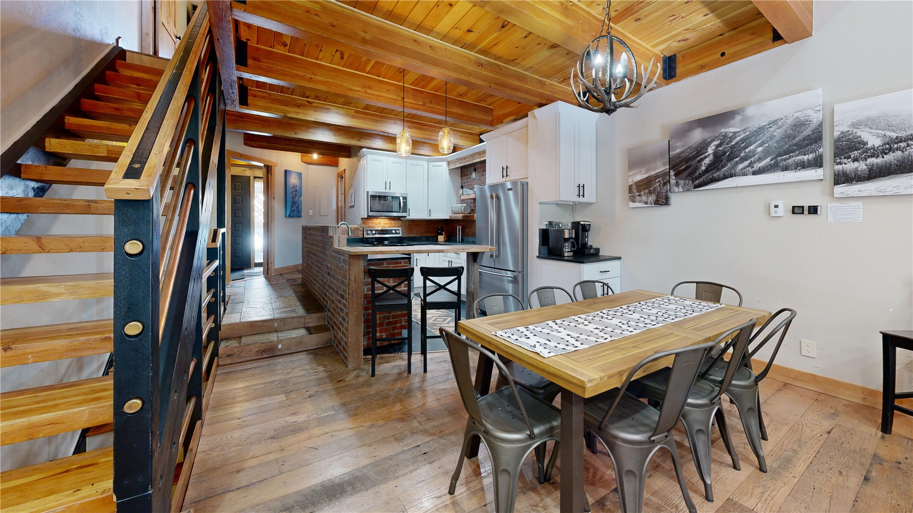 2739 Burgess Creek Road, Unit 10 Steamboat Springs, CO 80487 - Photo 16 of 46 a view of a dining room with furniture and a kitchen