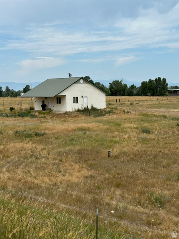 636 Cemetery Road Dingle, ID 83233 - Photo 1 of 22 Single-story residence featuring light-colored siding and a dark green metal roof