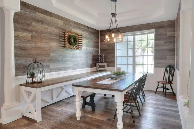 a view of a dining room with furniture window and wooden floor