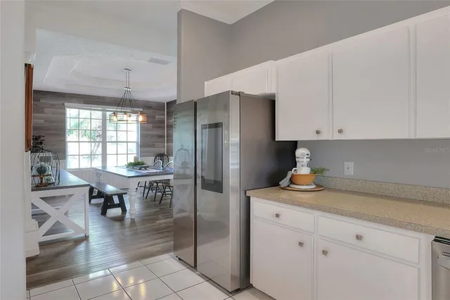 a kitchen with a sink and a stove top oven