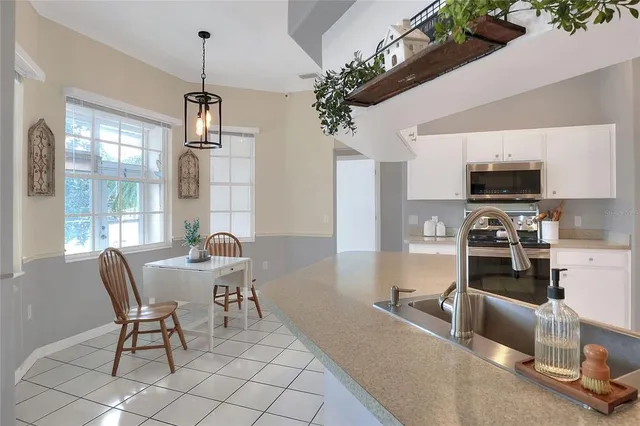 a view of a livingroom with furniture and windows