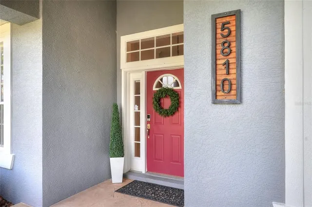 a living room with fireplace furniture and a flat screen tv