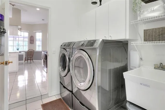 a view of a house with swimming pool and a yard