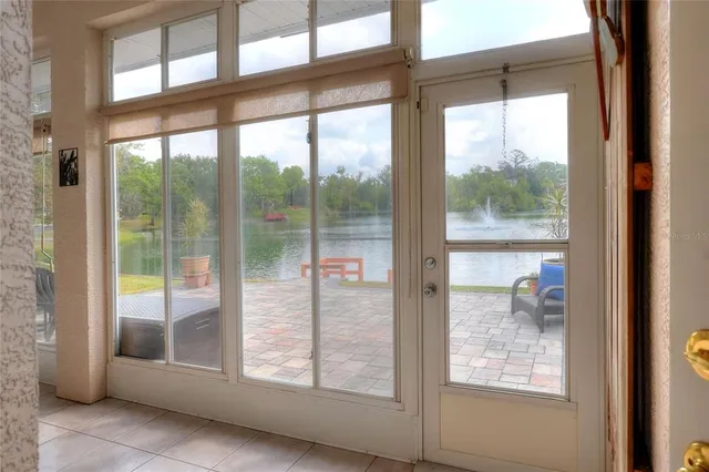 a view of a house with swimming pool and sitting area