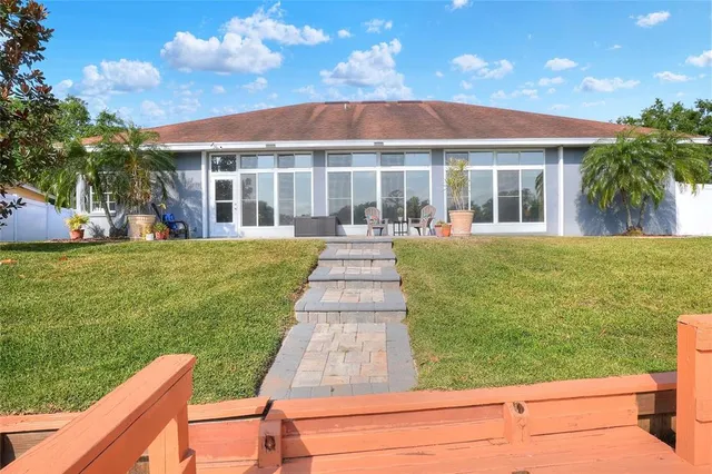 a view of a backyard with sitting area