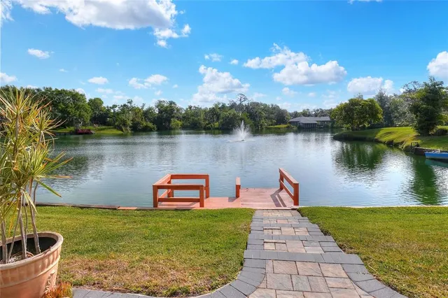 a front view of a house with yard and outdoor seating