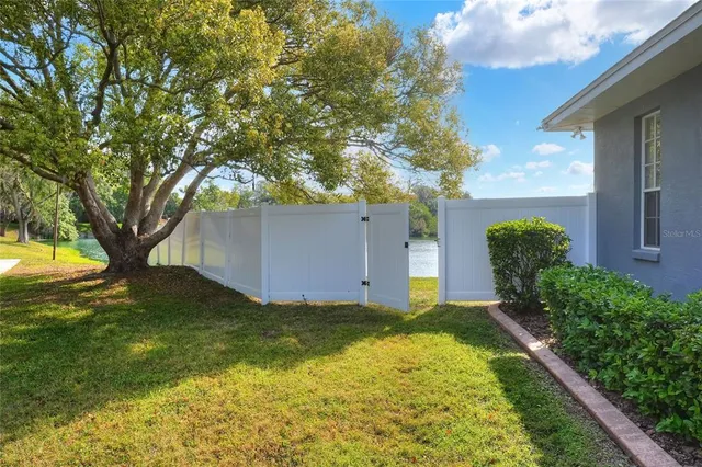 an aerial view of a houses with a lake view