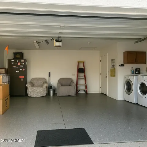 a utility room with multiple dryer and washer