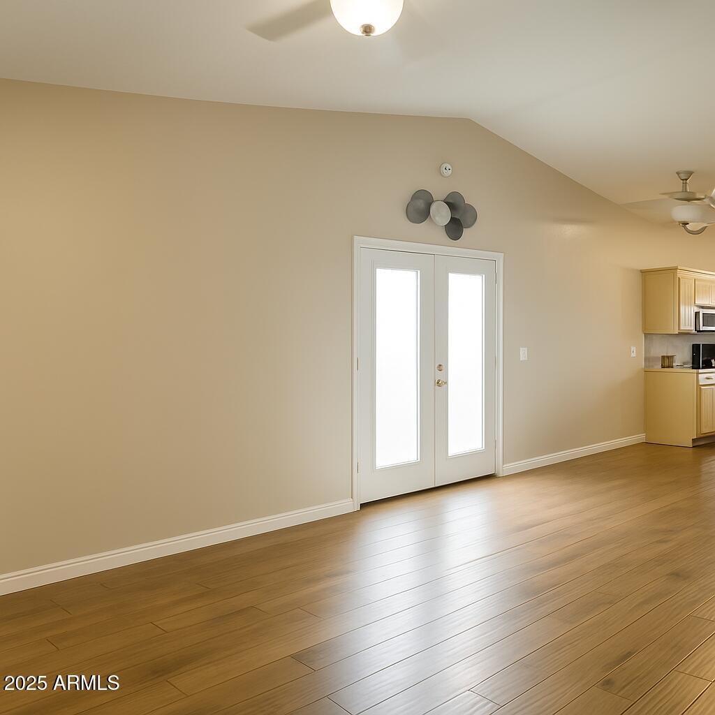 1708 West Cortez Circle Chandler, AZ 85224 - Photo 4 of 22 a view of an empty room with wooden floor and a window