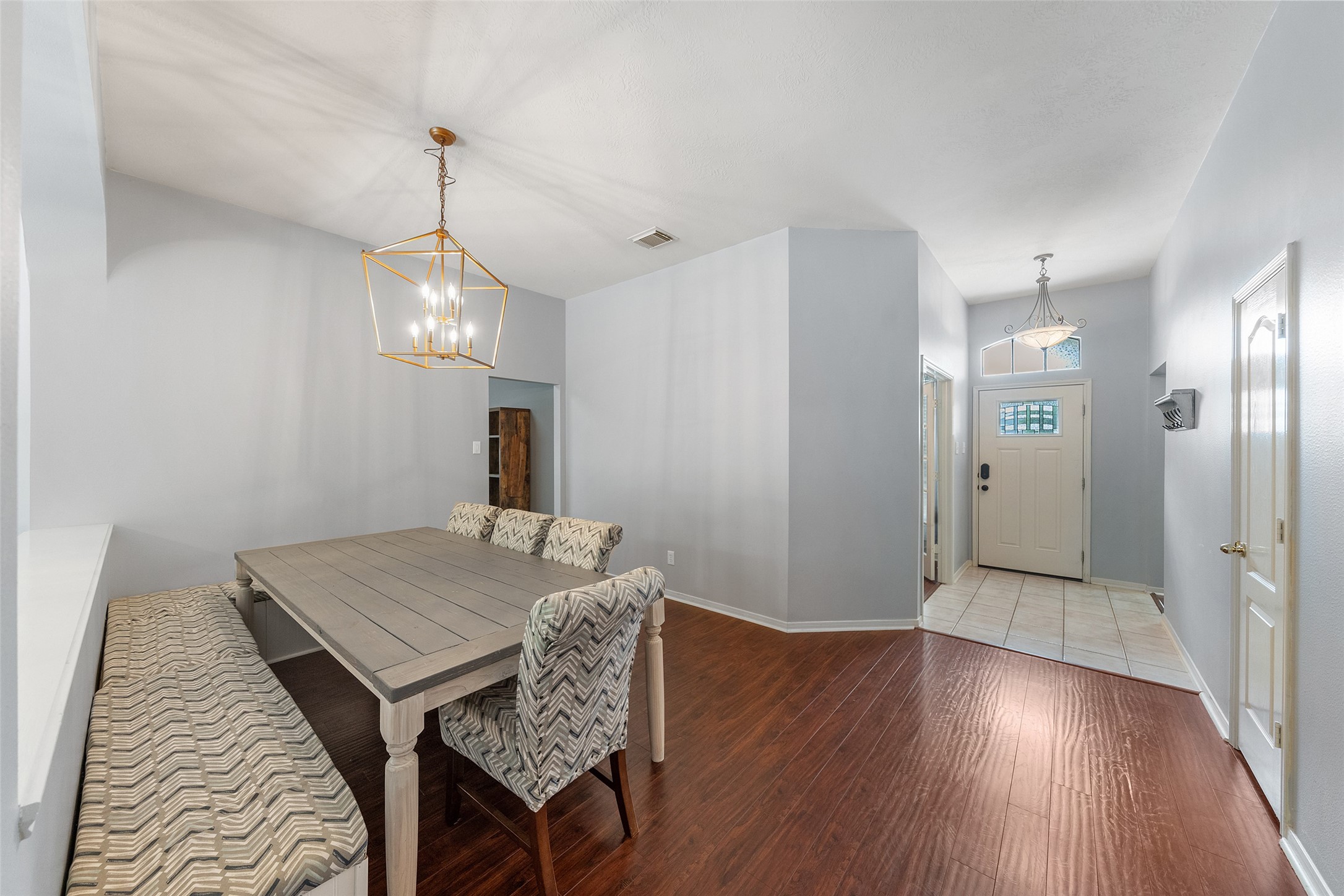 19718 Teller Boulevard Spring, TX 77388 - Photo 8 of 47 a view of a dining room with furniture and wooden floor