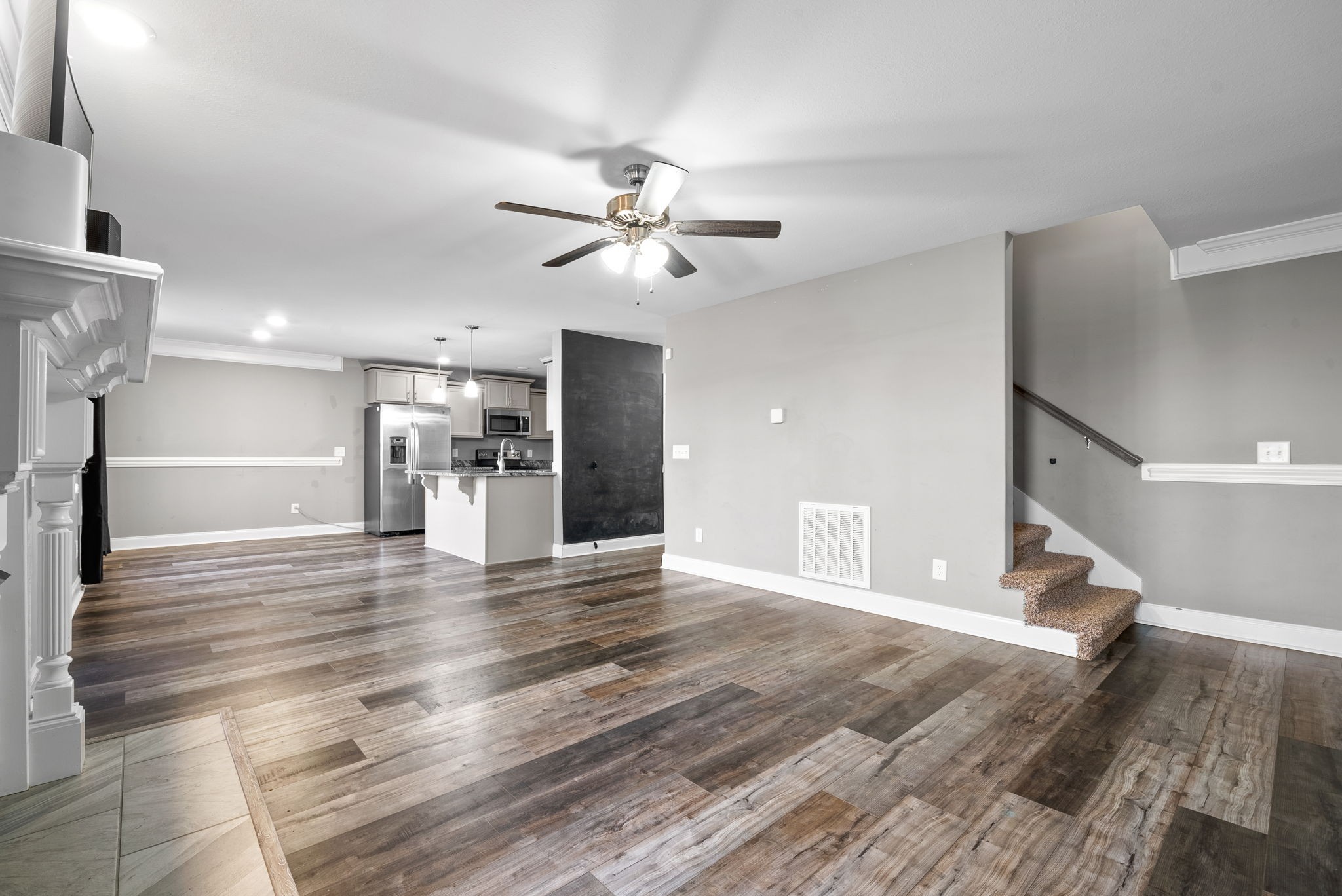1868 Rains Road Clarksville, TN 37042 - Photo 11 of 39 a view of empty room with wooden floor and a ceiling fan