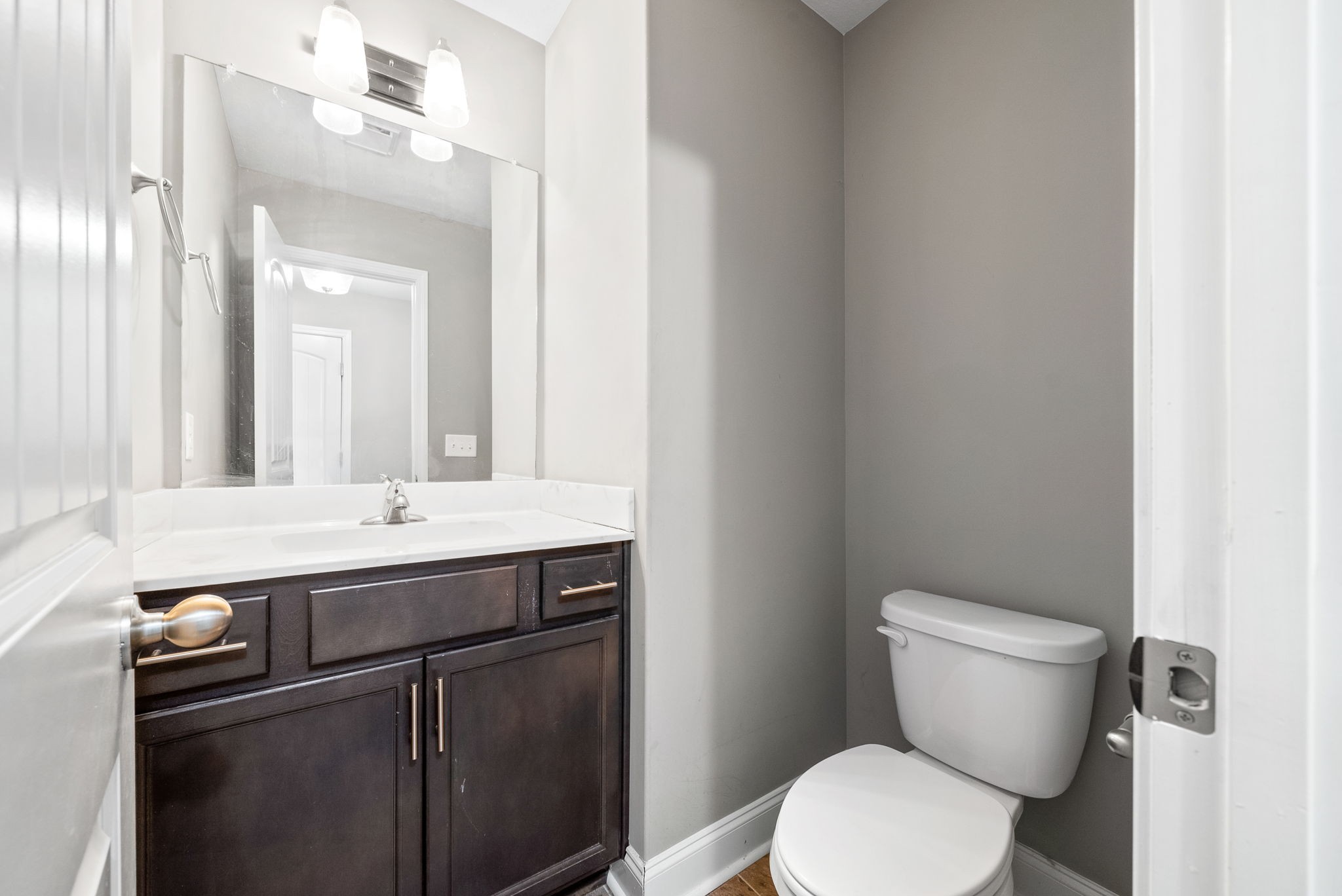 1868 Rains Road Clarksville, TN 37042 - Photo 12 of 39 a bathroom with a toilet sink and mirror