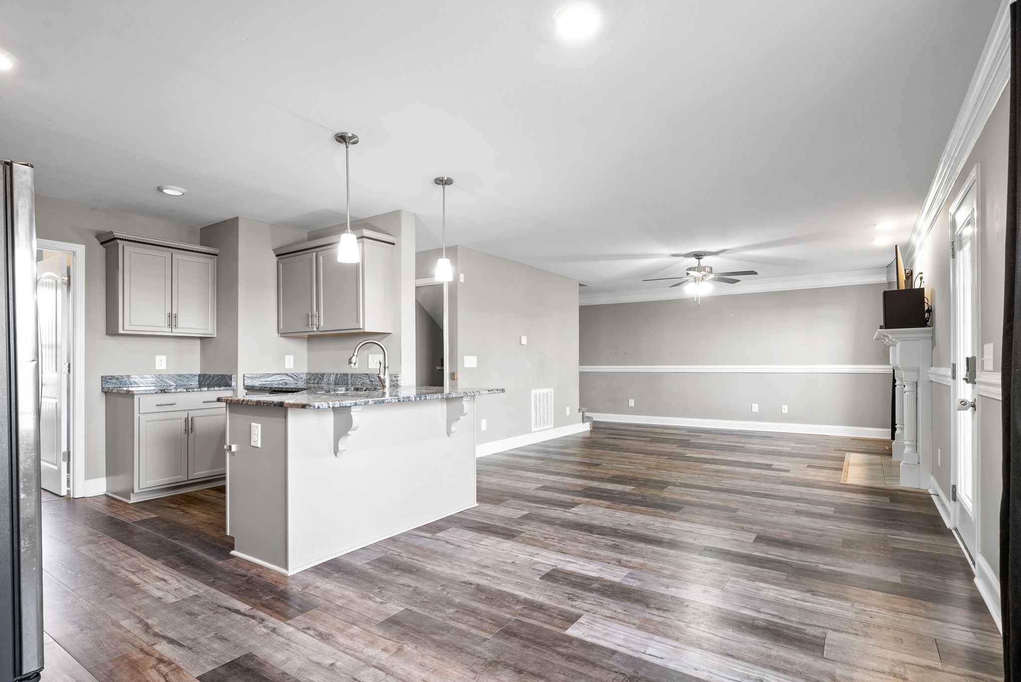 1868 Rains Road Clarksville, TN 37042 - Photo 14 of 39 a kitchen with stainless steel appliances kitchen island granite countertop a refrigerator and a stove top oven
