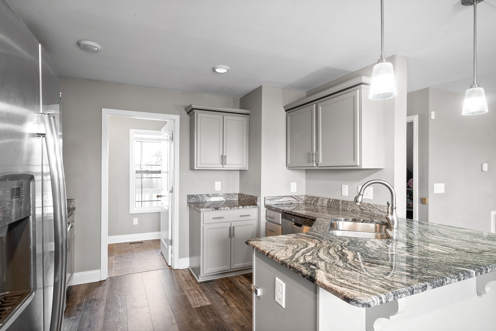 1868 Rains Road Clarksville, TN 37042 - Photo 15 of 39 a kitchen with stainless steel appliances granite countertop a sink stove and refrigerator