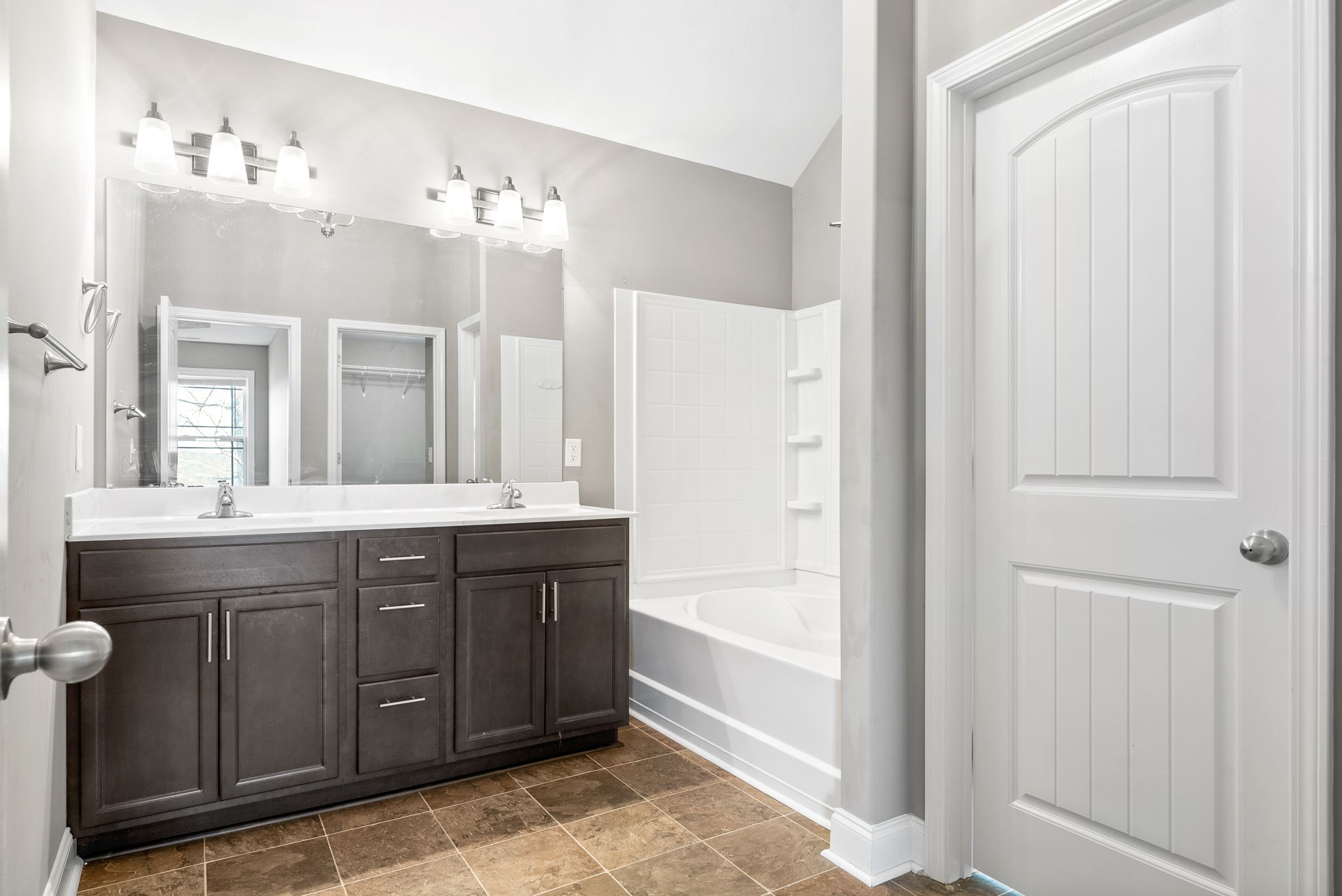 1868 Rains Road Clarksville, TN 37042 - Photo 21 of 39 a spacious bathroom with a double vanity sink mirror and bathtub