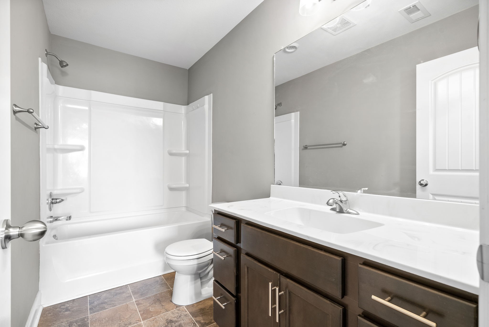 1868 Rains Road Clarksville, TN 37042 - Photo 25 of 39 a bathroom with a sink a toilet and a large mirror