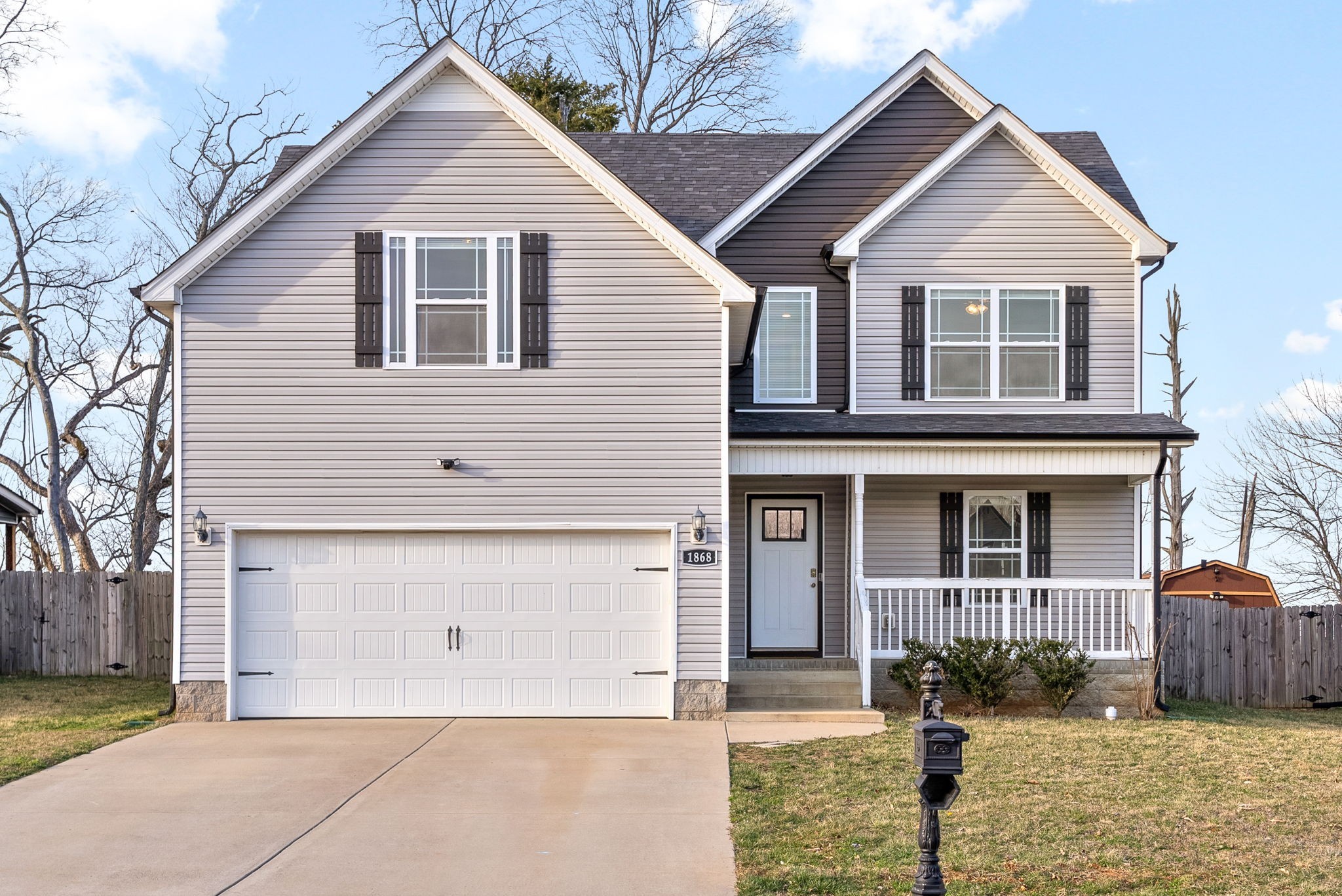 1868 Rains Road Clarksville, TN 37042 - Photo 4 of 39 a front view of a house with a yard and garage
