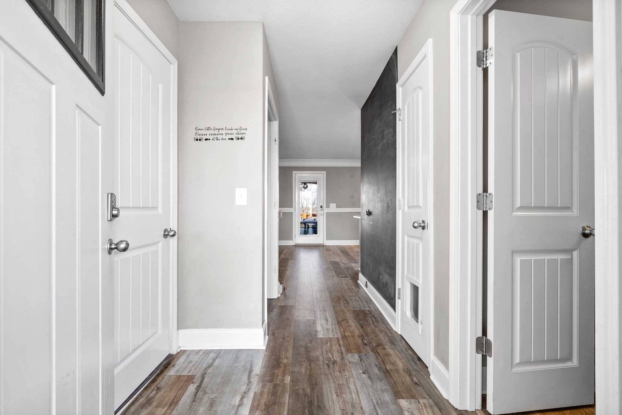 1868 Rains Road Clarksville, TN 37042 - Photo 6 of 39 a view of a hallway with wooden floor and staircase
