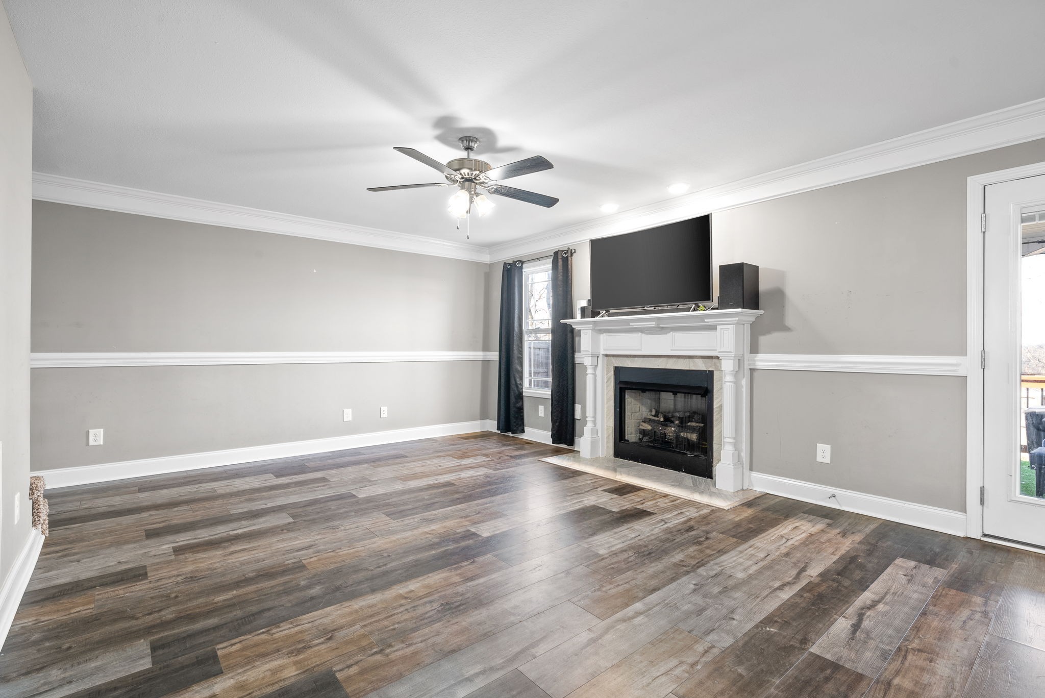 1868 Rains Road Clarksville, TN 37042 - Photo 7 of 39 a view of an empty room with fire place and a window