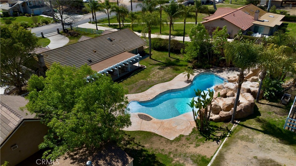 16630 Arabian Avenue Riverside, CA 92504 - Photo 38 of 42 an aerial view of a house with a yard and lake view