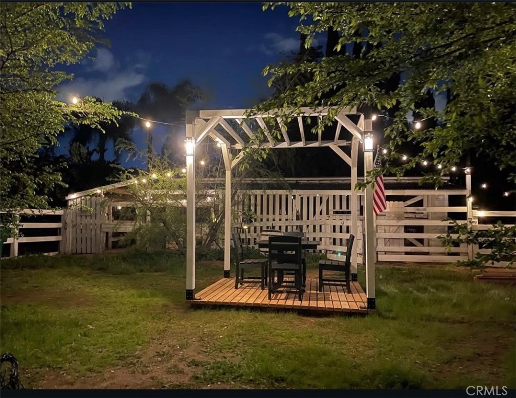 16630 Arabian Avenue Riverside, CA 92504 - Photo 40 of 42 a view of a house with backyard porch and sitting area