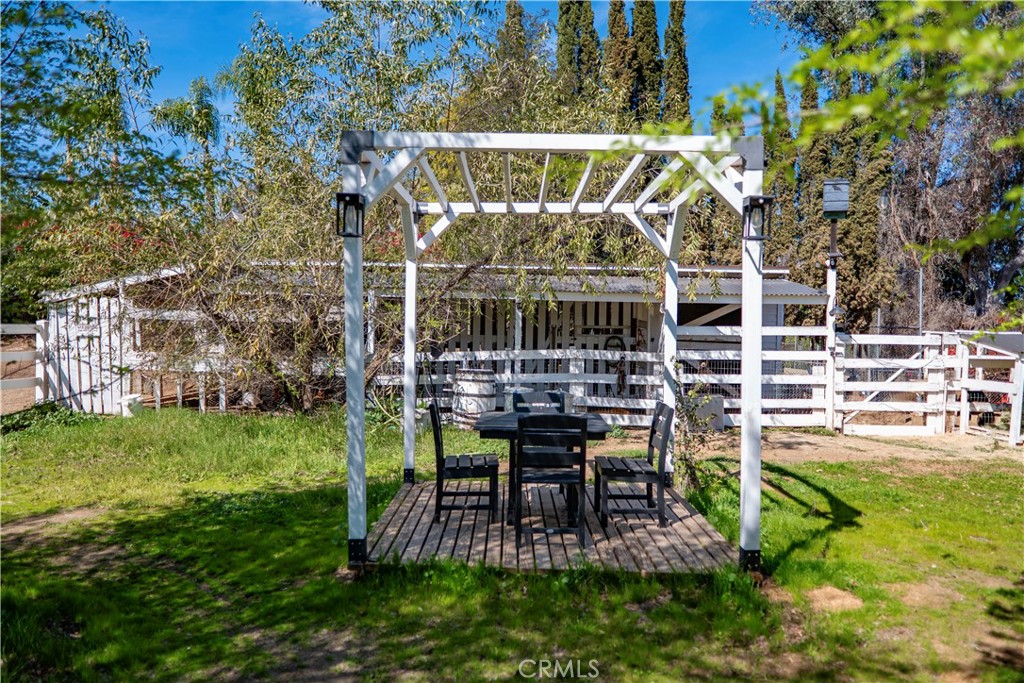 16630 Arabian Avenue Riverside, CA 92504 - Photo 7 of 42 a view of a chair and table in backyard of the house