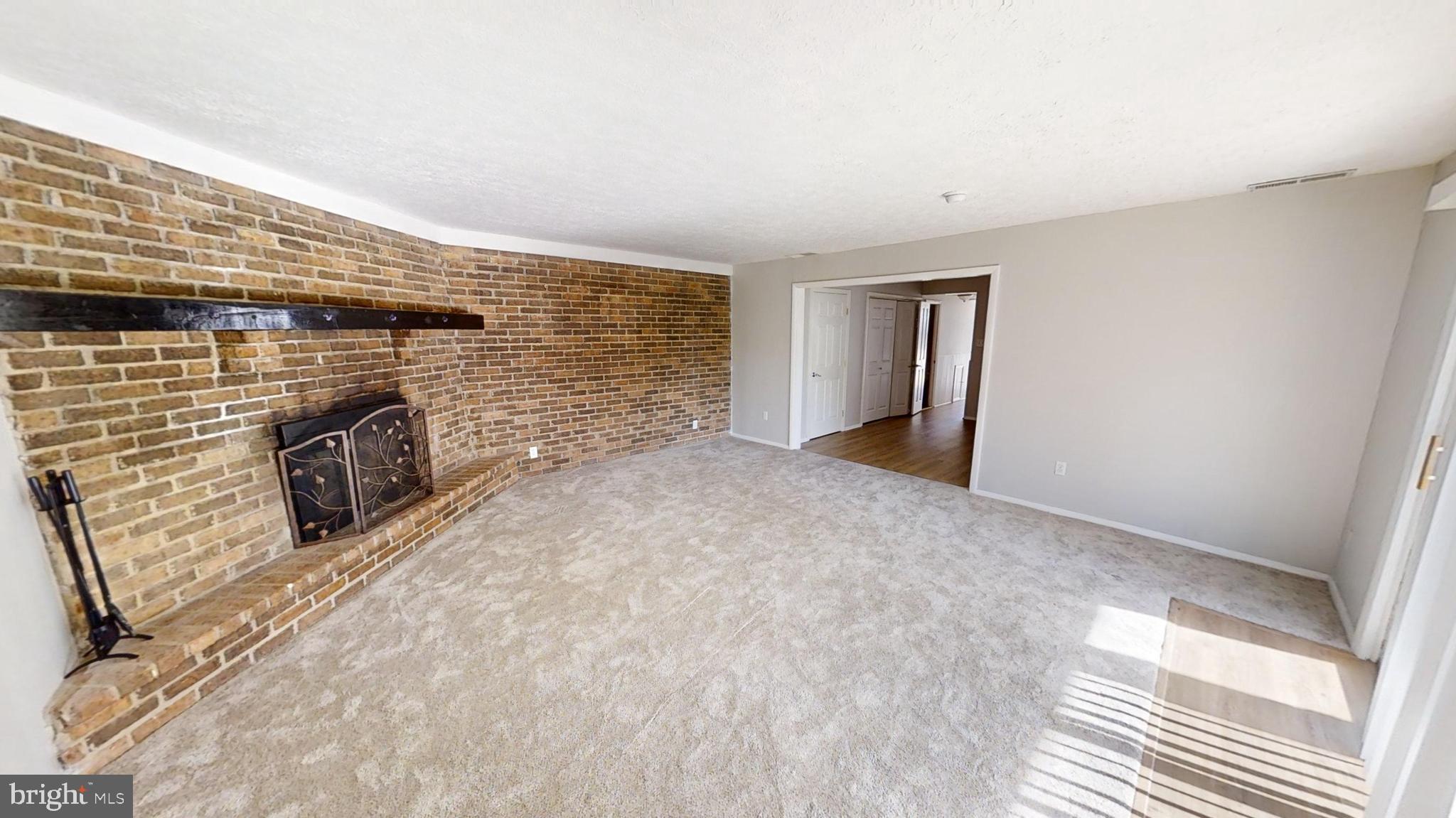 150 Dunlap Road Pasadena, MD 21122 - Photo 11 of 24 a view of empty room with fireplace